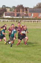 Alex playing rugby