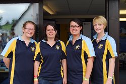 Four Harper students ready to talk to visitors about the University College