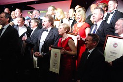 Richard and Zoey on stage with other award winners