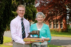 Harry receives his trophy from Mrs Sheila Lewis