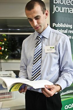 A delegate reads some conference literature. A delegate reads some conference literature.