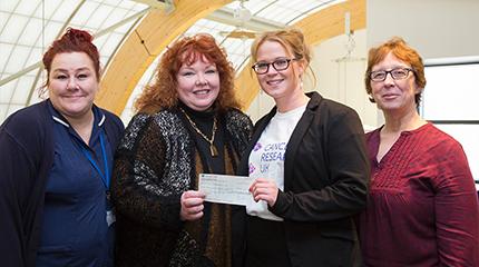Staff raise £1,380 for Cancer Research
