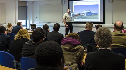 American professor gives guest lecture on “grandest challenge of all time”