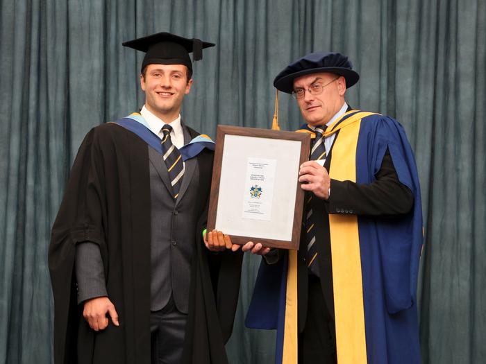 Joe receives the RASE Award from course manager Russell Readman