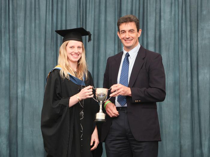 Becca receives the award from Steve Jarrett, of Wynnstay