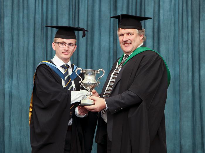 Ben receives the award from Alan Stewart.