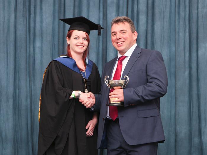 Samantha Glew receives her award from Andrew Brodie