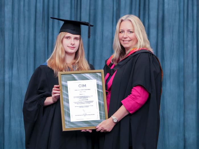 Sarah receives the CIM Prize from Tricia Parrott