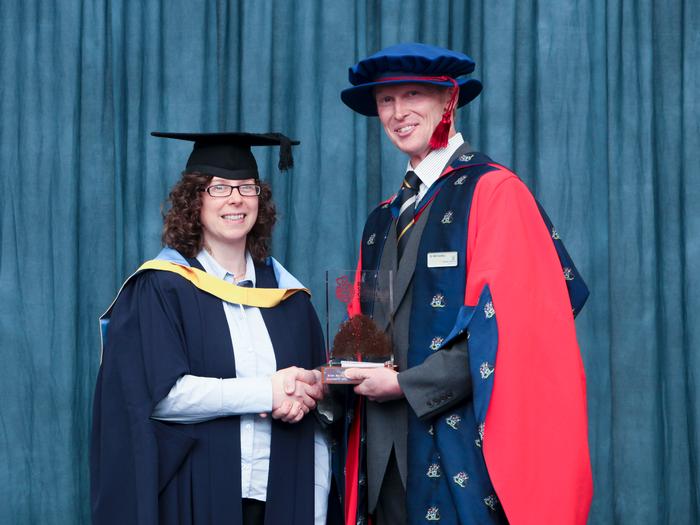 Nichola Taylor receives the British Society for Soil Science Postgraduate Award from Dr William Hartley