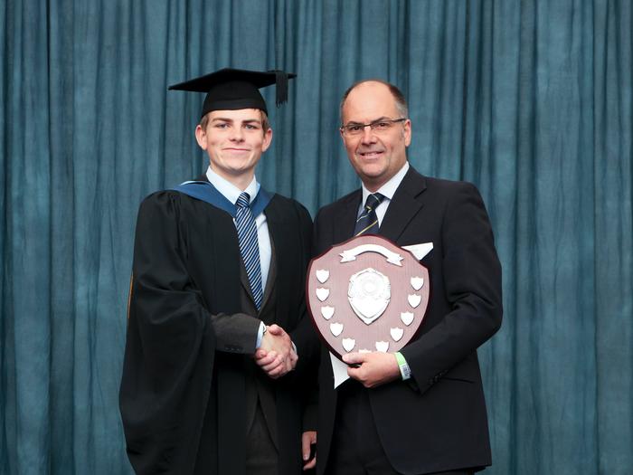 Tom receiving the trophy from Paul Fogg, Frontier Agriculture. 