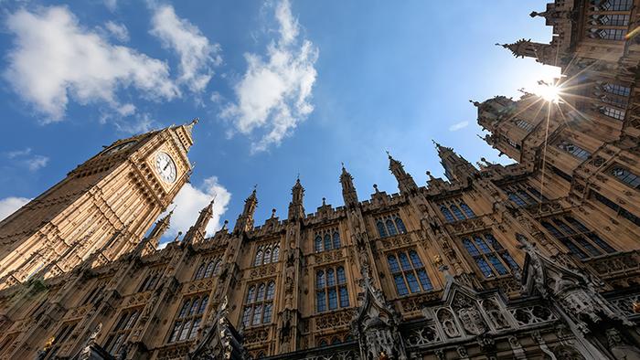 The Houses of Parliament under a blue sky