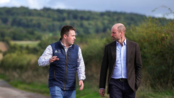 Harry Davies and His Royal Highness Prince William, The Duke of Cornwall, in conversation at Monkhall Farm