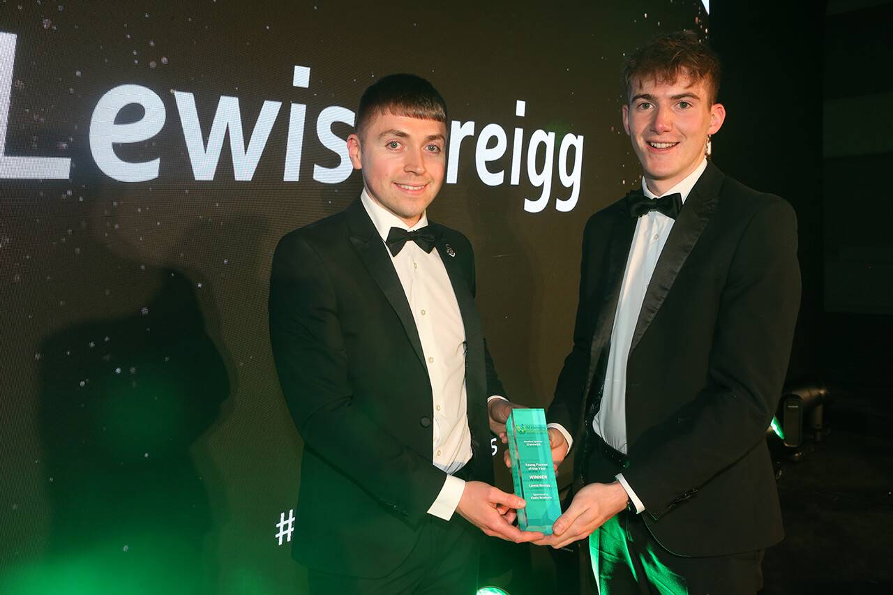 Lewis Gregg pictured collecting the award for Young Farmer of the Year, presented by Joel Eakin, award sponsor